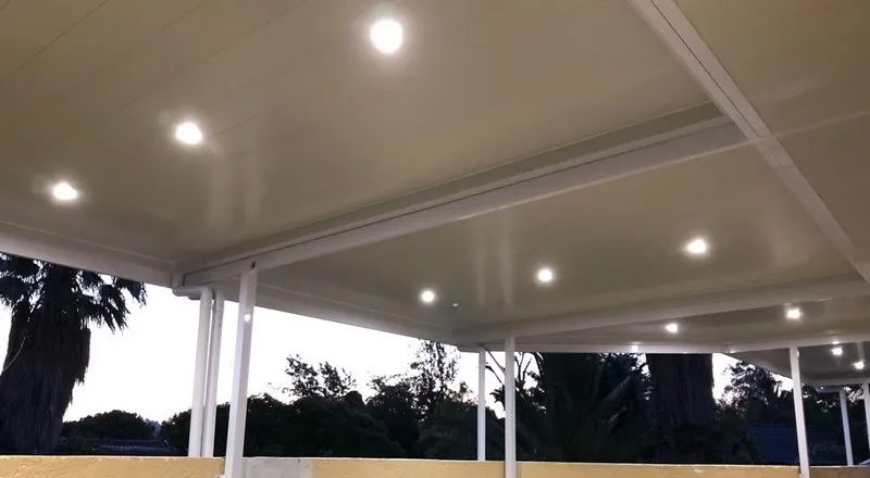 Aluminium ceiling brightening a covered entertainment area