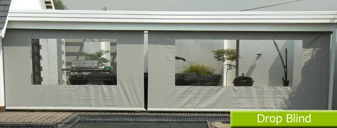 Canvas drop blinds lowered along a veranda