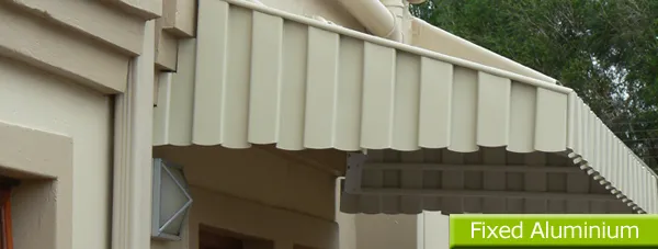 Window awnings in baked aluminium on a double-storey home