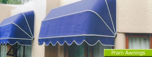 Traditional canvas pram awning over a period window