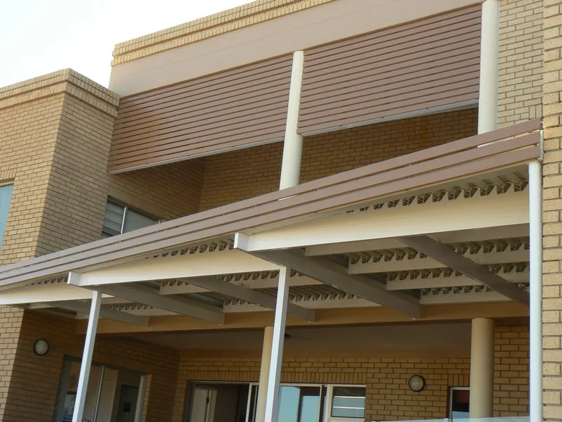 Curved polycarbonate awning over a front door