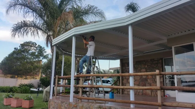 Barrel-curved polycarb canopy over an entrance