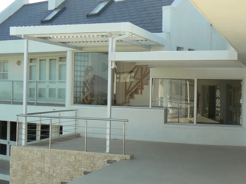 Opal polycarbonate canopy over a courtyard door