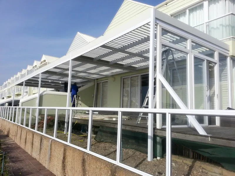 Louvre awning being installed on a coastal home