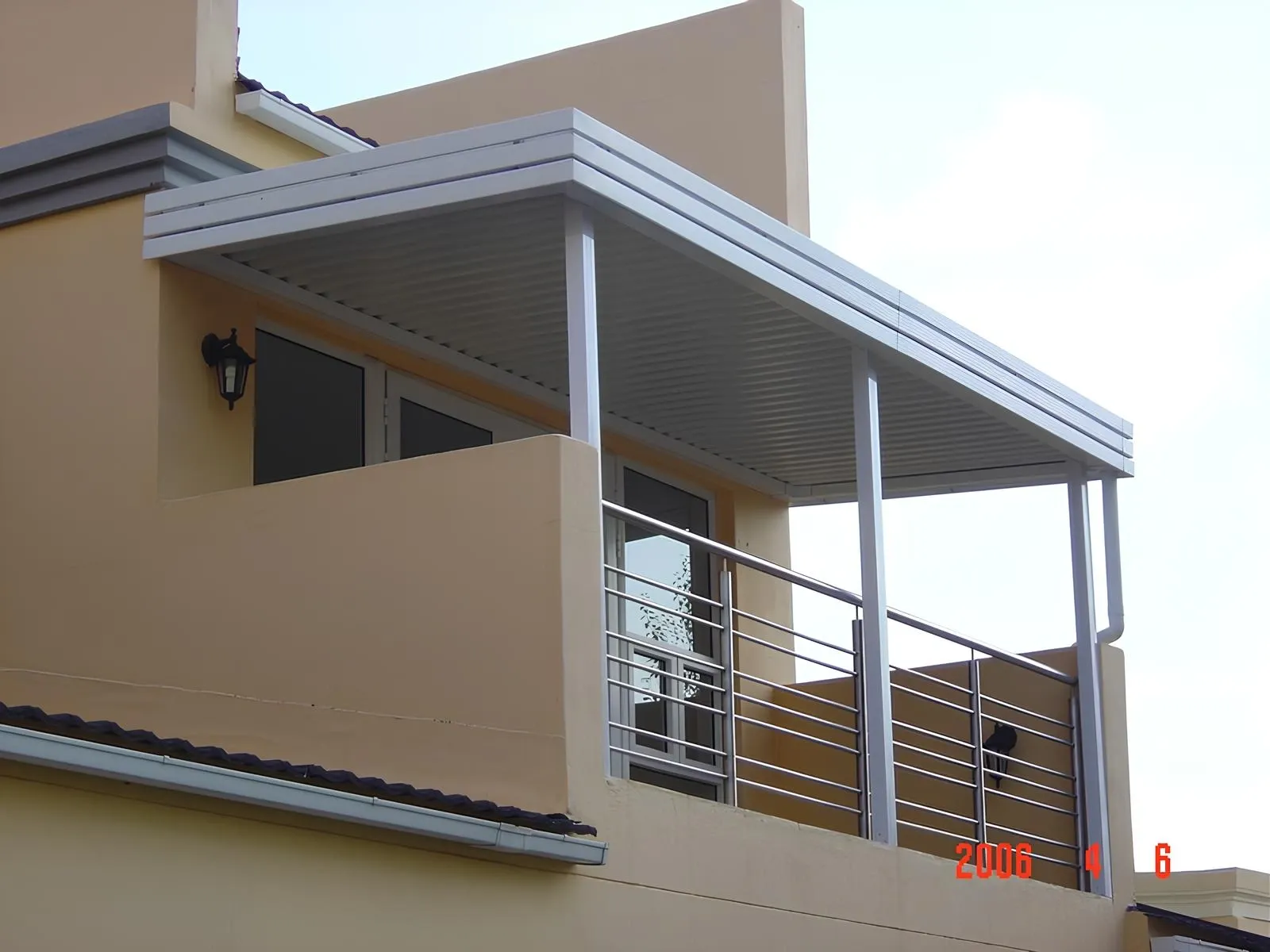 Patio roof combining aluminium IBR sheeting with translucent polycarbonate panels